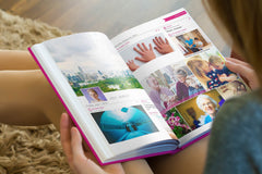 Woman browsing through her My Social Book photo book